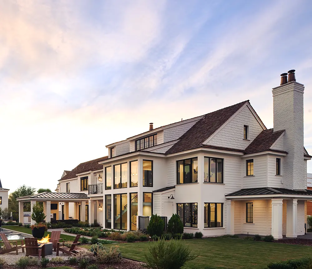 Modern house with white new exterior painting and black roof