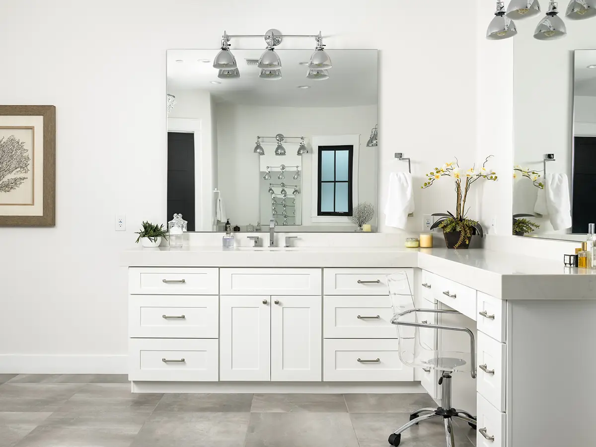 White vanity in modern white bathroom
