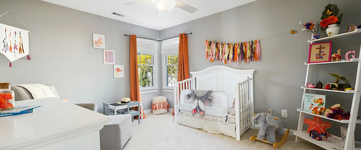 kids room with grey walls and white furniture
