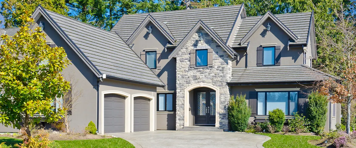 grey house exterior with stone work