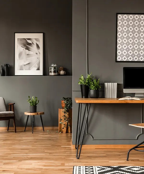 elegant office with grey walls and wooden furniture