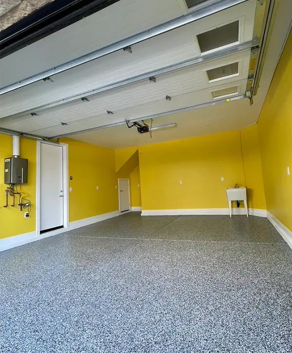 Epoxy garage flooring in Phoenix in a space painted yellow