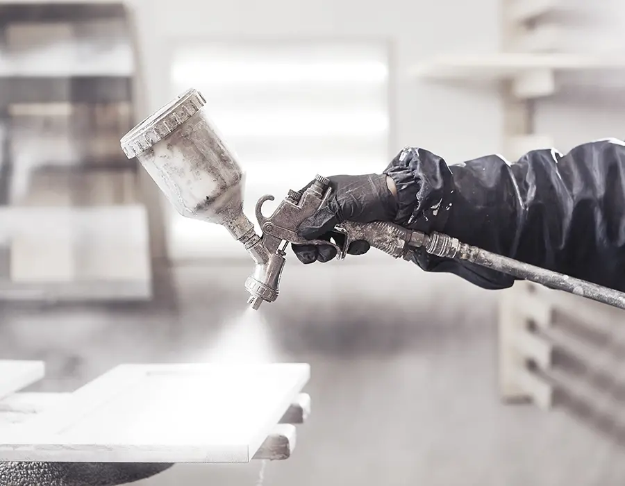 spray painting cabinets for a fresh coat of paint