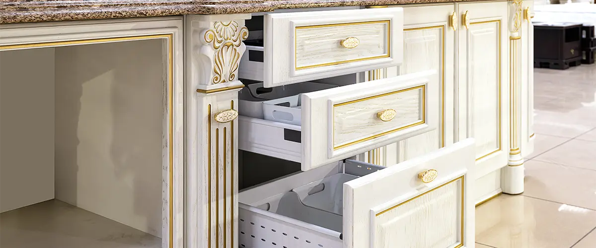 Beautiful kitchen cabinets painted white with gold accents