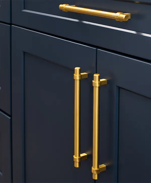 Navy blue cabinets with golden hardware