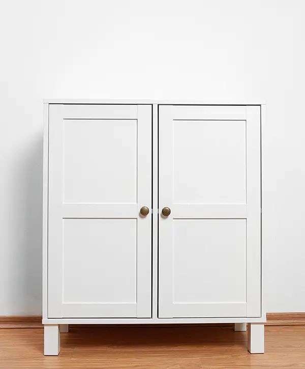Small white cabinet in living space