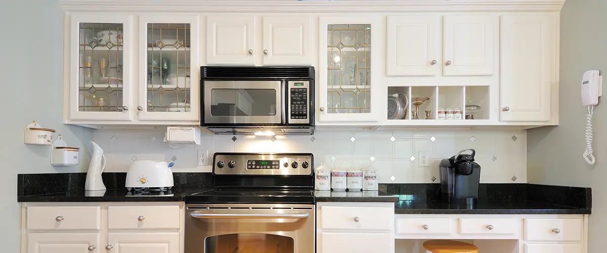 Traditional white cabinets in a dated kitchen